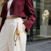 Gourd Fortune Charm — clothing accessory lifestyle view Gourd Fortune Charm — clothing accessory lifestyle view