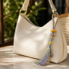 Rainbow Tassel Knot Charm — bag accessory lifestyle view