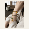 Verdant Harmony Bracelet — young East Asian woman styling view