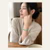 Verdant Round-Bead Bracelet — young East Asian woman styling view Verdant Round-Bead Bracelet — young East Asian woman styling view